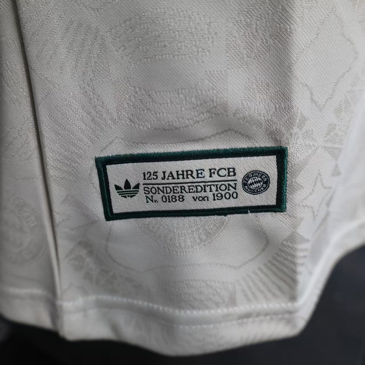 2025/26 Bayern Munich Beer Edition Player Version Jersey - Off-White Body - Dark Green Crew Neck Trim & Sleeve Cuffs - Bayern Munich Dark Green Special Crest - Deutsche Telekom T Dark Green Principal Sponsor