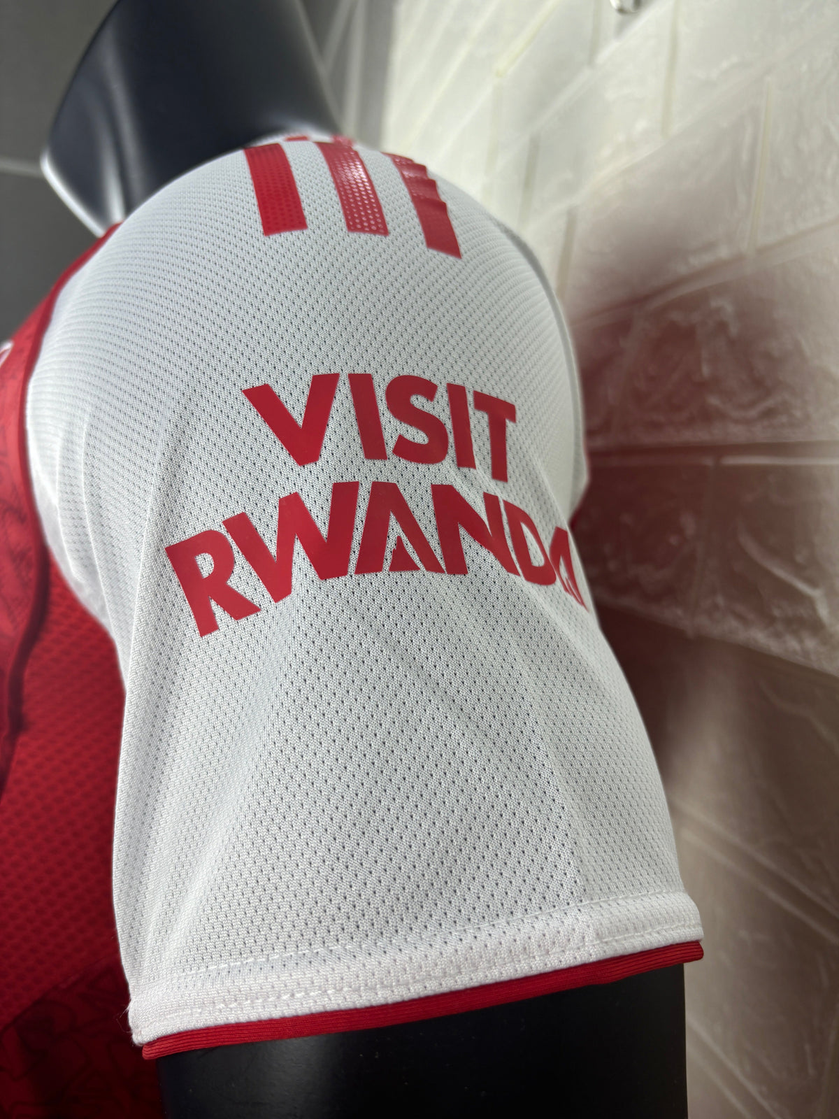 2025/26 Arsenal Home Player Version Jersey - Red Body White Sleeves Diamond Mesh Texture Red Side Seam Piping - White Three Stripes Left Chest - Arsenal Shield Crest Right Chest - Emirates Fly Better Principal Sponsor