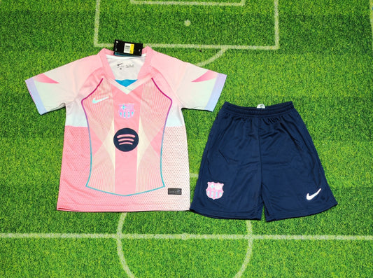 2025/26 FC Barcelona Kids Third Kit Set - Pink Jersey Navy Blue Shorts  - Pink Body White Lavender Sleeve Panels Teal V-Neck Geometric Radial Line Texture - White Nike Swoosh - FCB Pink Monochrome Crest - Spotify Navy Blue Sponsor