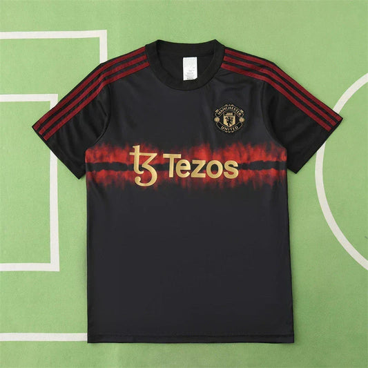 Manchester United Year of the Snake Limited Edition Training Shirt Fan Version 2024/25 – Black Gold Tezos Pre-Match Top