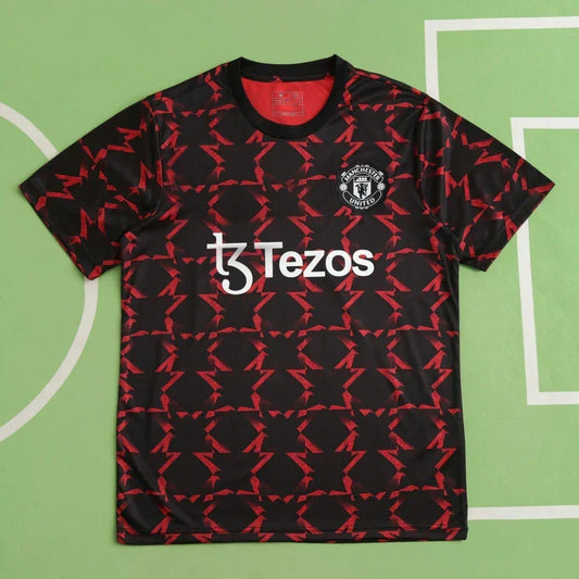 Manchester United Training Shirt Fan Version 2024/25 – Black Red Diamond Pattern Tezos Pre-Match Top