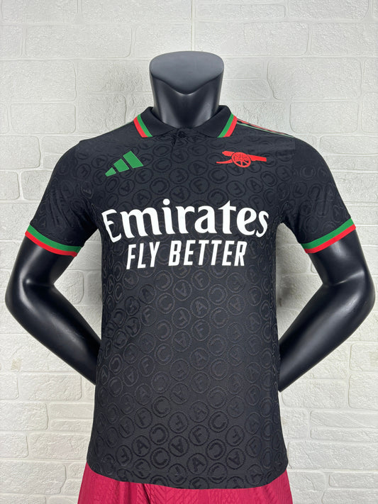 2025/26 Arsenal Special Edition Black Player Version Jersey - Black Body All-Over Tonal Cannon Circular Emboss Pattern Black Polo Collar Green Red Double Stripe Trim - Green Three Stripes - Red Arsenal Cannon Crest - Emirates Fly Better