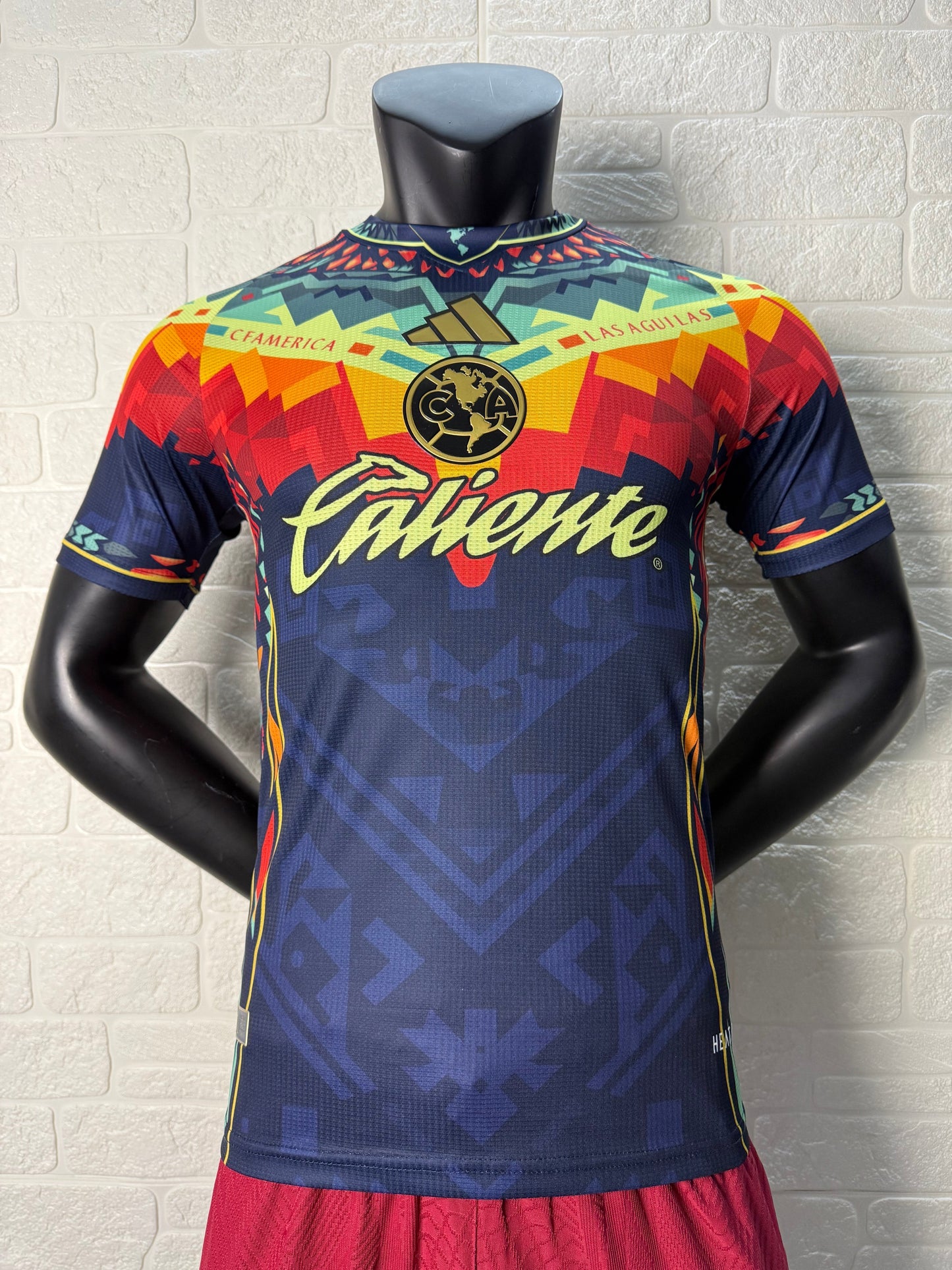 2025/26 Club América Training Player Version Jersey - Dark Navy Blue Body Multicolour Aztec Zigzag Graphic Upper Chest  - Gold Three Stripes - Club América Crest - Caliente Principal Sponsor